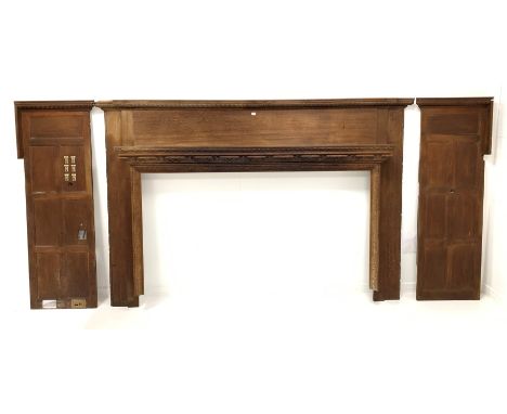 Large Edwardian oak fire surround, gadroon moulded break front cushion frieze over moulded mantel shelf and leaf and floral c