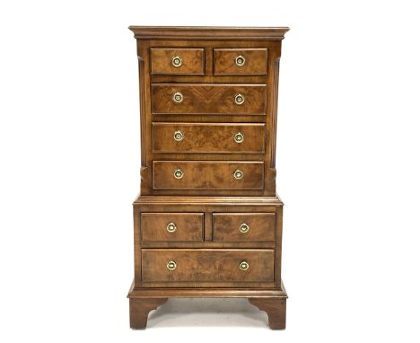 Reproduction figured walnut miniature tallboy, half sawn veneered and cross banded top over two short and three long drawers 
