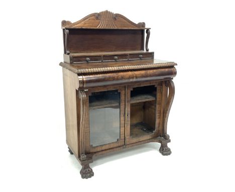 Irish Regency mahogany chiffonier, the raised back with scroll and lobe carved arched pediment and open shelf and three drawe