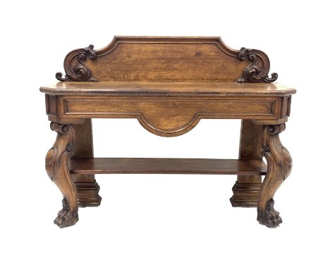 Victorian oak console table, the raised back with applied floral moulding over rectangular top with canted corners and panell