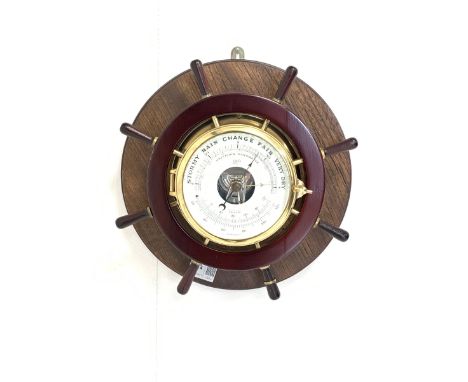 Nautical themed aneroid barometer and thermometer, white enamel dial enclosed by a bevel glazed bezel, brass bulk head case w