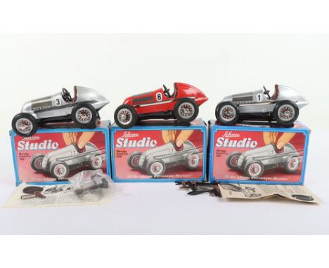 Three Boxed Schuco Studio Tinplate Mercedes Grand Prix 1936 Racing Cars, reissues, two in silver and one in red, all in near 