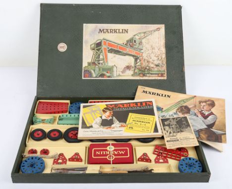 Marklin boxed constructing sets, circa 1960, sets 102 and 1032 containing a selectin of red, green and blue component parts i