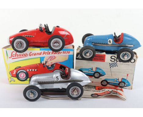 Three Schuco Tinplate Racing Cars, boxed 1050 Studio Mercedes 1936,blue, with leaflet and accessories, unboxed re issue 2098 