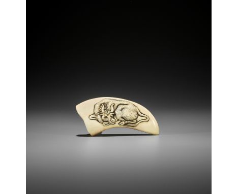 AN IWAMI STYLE BOAR TUSK NETSUKE DEPICTING A RECUMBENT OX UnsignedJapan, probably Iwami, 19th century, Edo period (1615-1868)