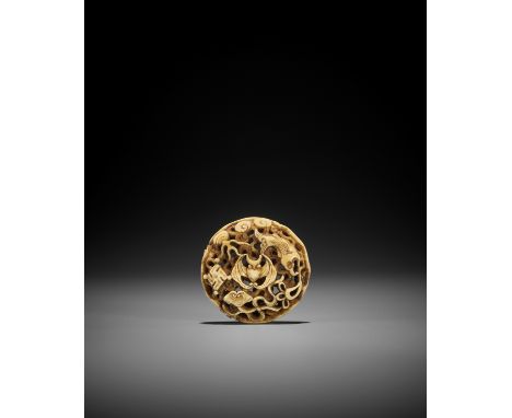 A WALRUS TOOTH RYUSA MANJU NETSUKE WITH AUSPICIOUS SYMBOLS UnsignedJapan, Tokyo, Asakusa, second half of 19th centuryPublishe