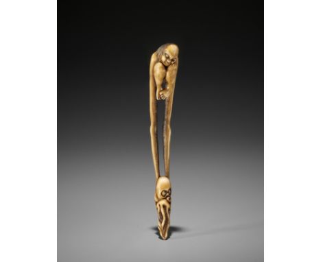 AN ASAKUSA STYLE STAG ANTLER OBIHASAMI NETSUKE OF TENAGA CATCHING AN OCTOPUS UnsignedThe obihasami finely stained and carved 