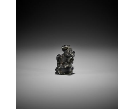 NIZAN: AN EBONY WOOD NETSUKE OF TENJIKU TOKUBEI By Nizan, signed Nizan 二山Japan, first half of 19th century, Edo period (1615-