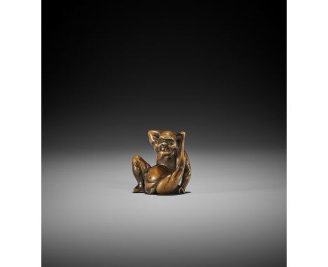 AN EDO SCHOOL WOOD NETSUKE OF A CONTORTIONIST UnsignedJapan, Edo (Tokyo), c. 1800, Edo period (1615-1868)Finely carved as a m