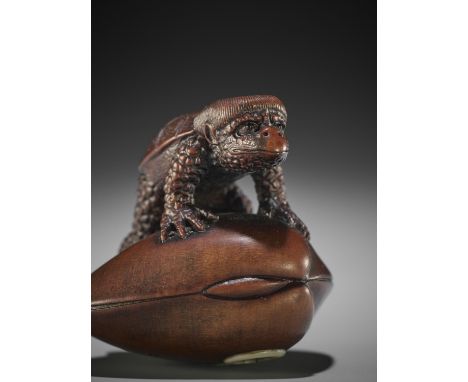 SUKEHARU: A FINE WOOD NETSUKE OF A KAPPA ON CLAM By Eguro Sukeharu (born 1831), signed Sukeharu 亮治Japan, Takayama, Hida provi