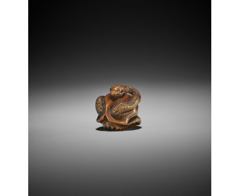 MASAMITSU: A WOOD NETSUKE OF SNAKE AND SKULL By Masamitsu, signed Masamitsu 正光Japan, Ise-Yamada, mid-19th century, Edo period