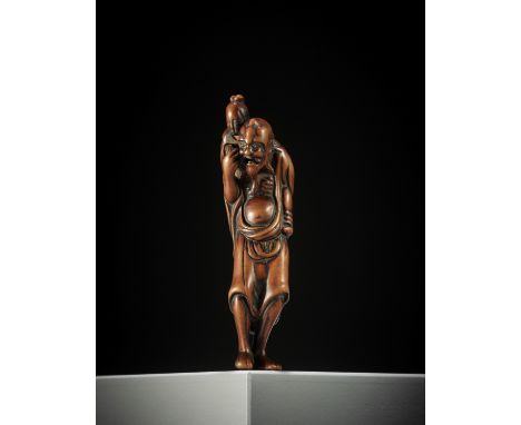 A TALL EARLY EDO SCHOOL WOOD NETSUKE OF IKKAKU SENNIN CARRYING THE LADY OF BENARES UnsignedJapan, Edo (Tokyo), late 18th cent