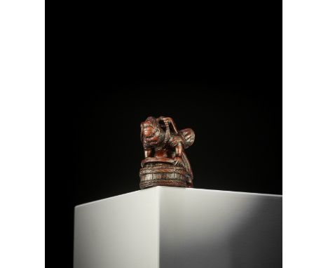 ITTAN: A WOOD NETSUKE OF SHOKI CAPTURING ONI By Ittan, signed Ittan 一旦 with kakihanJapan, Nagoya, first half of 19th century,