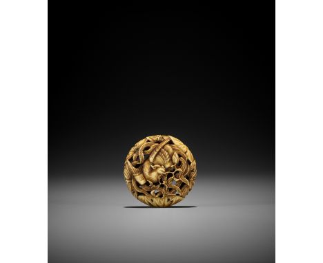 A FINE IVORY RYUSA MANJU NETSUKE WITH HO-O BIRD AND LOTUS UnsignedJapan, Tokyo, Asakusa, second half of 19th centuryThe ho-o 