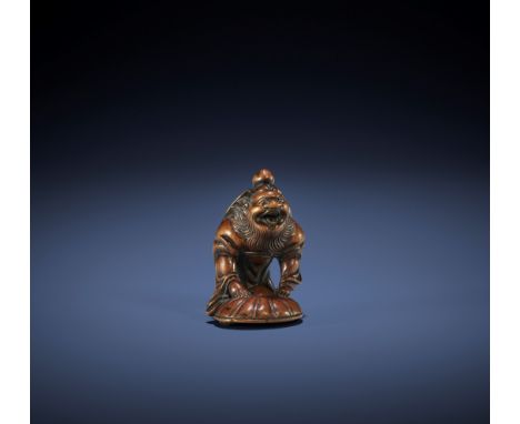 A HUMOROUS HAKATA SCHOOL WOOD NETSUKE OF SHOKI AND ONI UnsignedJapan, Hakata, early 19th century, Edo period (1615-1868)A hum