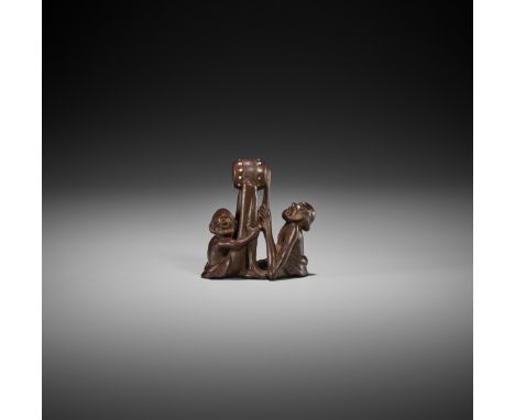 RAKUMIN: AN AMUSING WOOD NETSUKE OF ASHINAGA AND TENAGA PLAYING A DRUM By Ho Rakumin, signed Rakumin 樂民Japan, Edo/Tokyo, seco