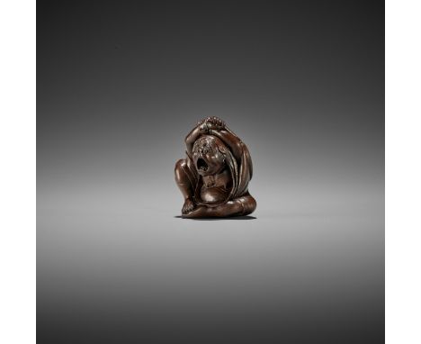 KOMIN: A SUPERB WOOD NETSUKE OF DARUMA YAWNING By Komin, signed Komin 光珉 with kakihanJapan, Edo (Tokyo), mid-19th century, Ed