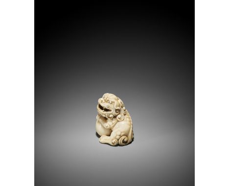 GECHU: AN IVORY NETSUKE OF A SHISHI WITH BALL Signed Gechu 牙虫Japan, Kyoto or Osaka, late 18th to early 19th century, Edo peri