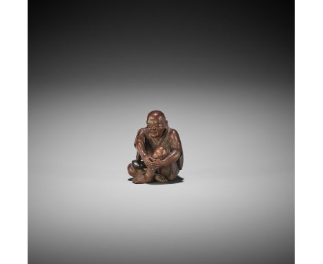 A FINE INLAID SO SCHOOL WOOD NETSUKE OF A MAN APPLYING MOXA UnsignedJapan, Tokyo, early 20th centuryDepicting a seated man, h