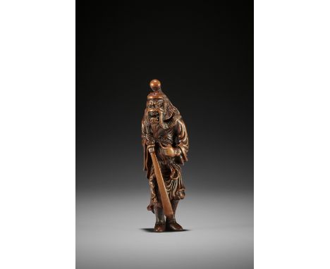 A SUPERB AND TALL WOOD NETSUKE OF SHOKI UnsignedJapan, 18th century, Edo period (1615-1868)A large, powerful, and boldly carv