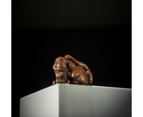 SATO MASAYOSHI: A FINE WOOD NETSUKE OF A TIGER By Sato Masayoshi, signed Masayoshi 正義Japan, Nagoya, 19th century, Edo period 