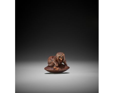 TSUYAMA: A WOOD NETSUKE OF A KAPPA CAUGHT IN A GIANT HAMAGURI By Tsuyama, signed Tsuyama 亞山Japan, Nagoya, 19th century, Edo p