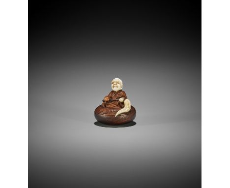 TO: A WOOD AND IVORY TOKYO SCHOOL NETSUKE OF A RAKAN IN AN ALMS BOWL By a follower of Tokoku, signed To 東Japan, Tokyo, Meiji 