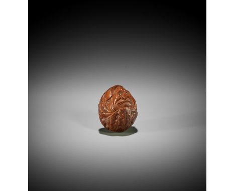 A KURUMI (WALNUT) NETSUKE OF A ROLY-POLY DARUMA, ATTRIBUTED TO HIDARI ISSAN Attributed to Hidari Issan, unsignedJapan, Iwashi