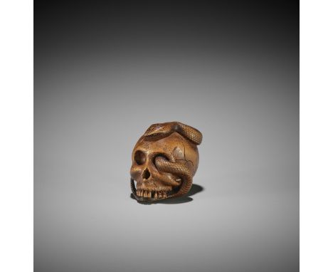 SUKEYUKI: A MASTERFUL WOOD NETSUKE OF A SNAKE AND SKULL By Sukeyuki, signed Sukeyuki 亮之Japan, Takayama, Hida province, second
