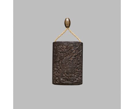 TACHIKAWA TOMITANE: A RARE CARVED KUROGAKI (BLACK PERSIMMON) WOOD THREE-CASE INRO WITH DRAGON AND KIRIN By Tachikawa Tomitane