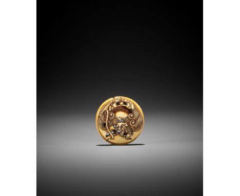 A STAINED IVORY RYUSA MANJU NETSUKE WITH A SHISHI EMERGING FROM A MOKUGYO Unsigned, but carved in the manner of RensaiJapan, 