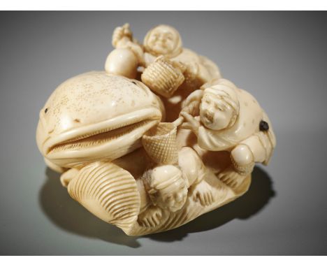 MIYAGI CHOKUSAI (B. 1877): A RARE IVORY NETSUKE OF FOUR MEN TRYING TO CAPTURE THE NAMAZU By Miyagi Chokusai (born 1877), sign