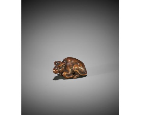 KOKEI: A WOOD NETSUKE OF A RECUMBENT OX By Kokei, signed Kokei 虎溪Japan, Kuwana, Ise province, early 19th century, Edo period 