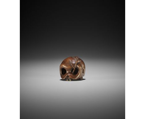 A FINE WOOD NETSUKE OF A SKULL WITH BAMBOO SHOOT UnsignedJapan, first half of 19th century, Edo period (1615-1868)A finely ca