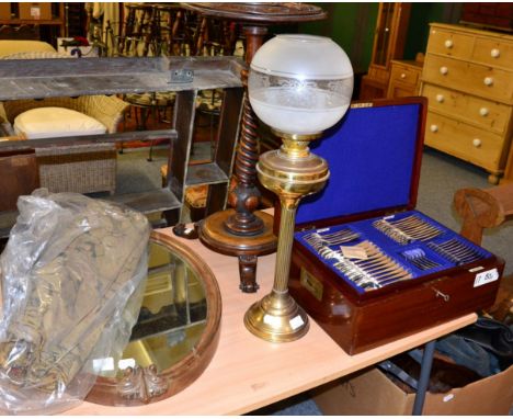 A Walker & Hall part canteen of silver plated flatware, a mahogany frame mirror, carved occasional table, a brass oil lamp et