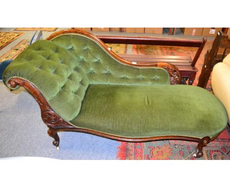 A mahogany framed sofa with mustard coloured upholstery 