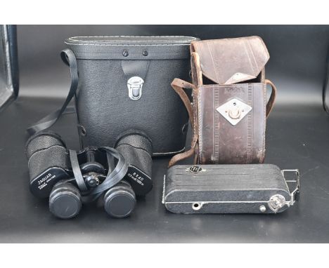 Jaguar binoculars in case together with a Kodak 620film camera in case