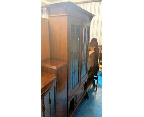 Arts &amp; Crafts leaded light oak display cabinet with copper hinges. Cupboard at bottom. 1 small crack in glass. 42”w x 15”