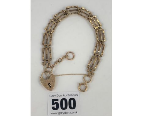 9k gold gate bracelet with heart lock, length 7”, w: 13.1 gms