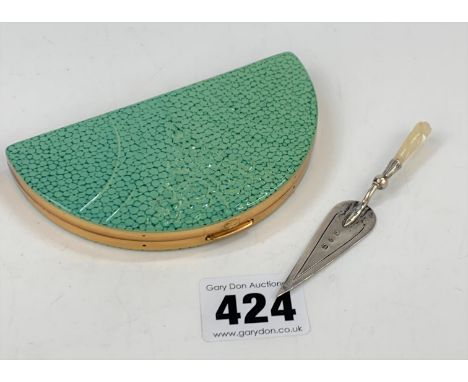 Brass and enamel half moon shaped compact 4”long and miniature silver trowel with mother-of-pearl handle 3.5” long