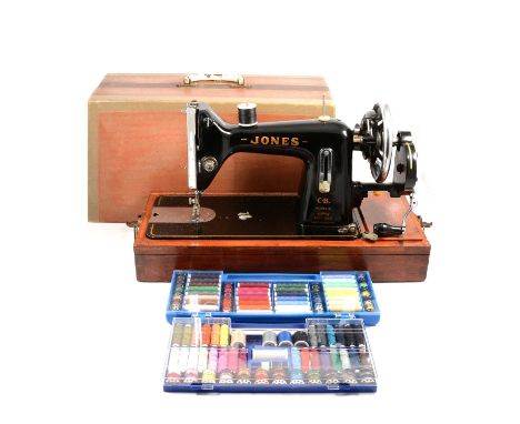 Vintage Jones Central Bobbin Model B sewing machine, in case, with two cases of bobbins and spools.