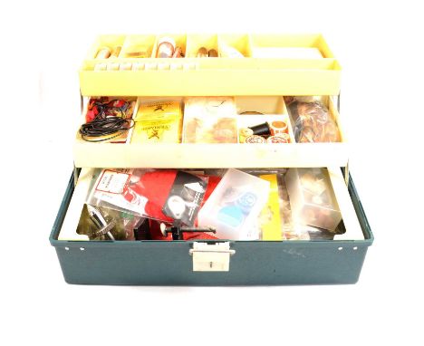 Fishing: a case of fly tying materials including vice, feathers, silks, other tools and accessories.