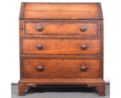 George III oak and mahogany banded bureau, fall front enclosing an adapted interior, three long graduating drawers below, tur
