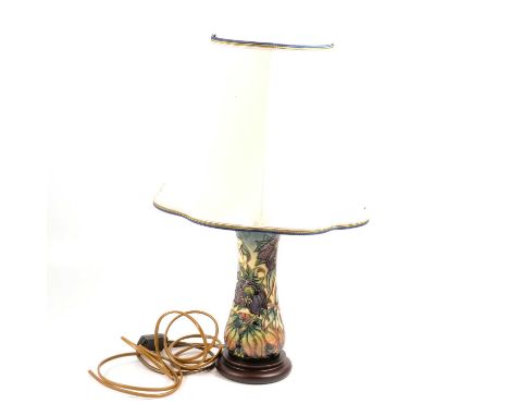 Moorcroft Pottery lamp, Hellebore pattern by Nicola Slaney, with silk shade, on turned wooden base, overall height 46.5cm.Con