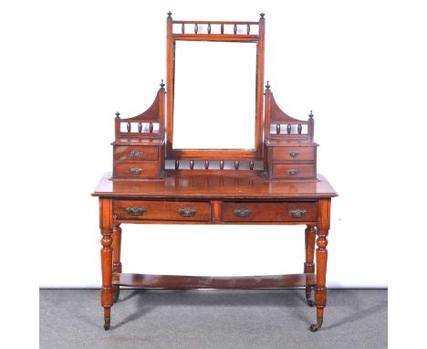 Victorian mahogany dressing table, tall rectangular mirror below a turned bobbin frieze, with two sets of trinket drawers to 