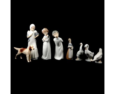 Eight pottery figurines including three Nao figures, a Lladro figure of a girl holding a piglet, three Nao ducks, and a Brank