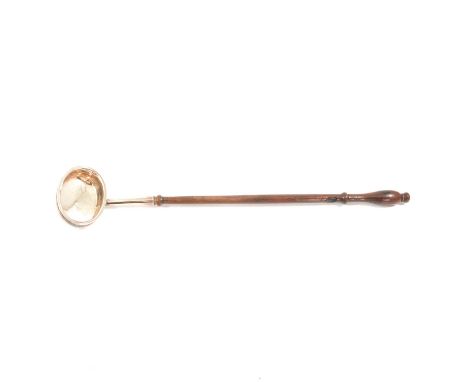 Georgian white metal toddy ladle, turned wood handle, makers mark IG, length 41cm.