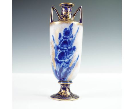 Extravagant vase with twin angular handles, featuring cobalt blue floral decoration and elaborate raised gilding. The tall tr
