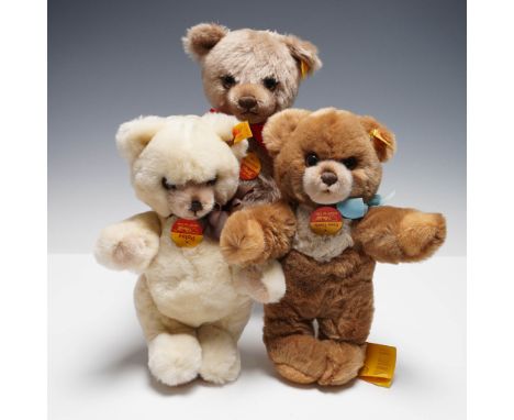 Charming three-piece Steiff bear collection, each with the iconic yellow ear tag and chest label. The lot includes one larger