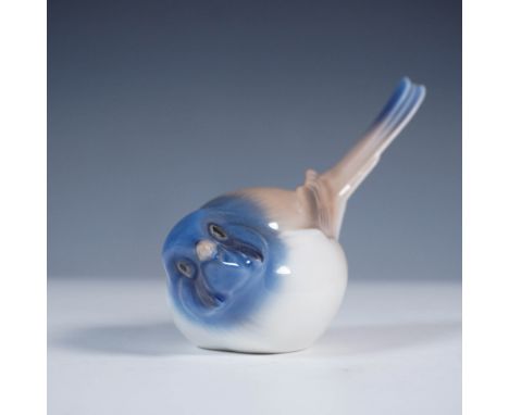 Crafted by the esteemed Danish porcelain manufacturer Bing &amp; Grondahl, this figurine titled Titmouse Optimist (No. 1633) 